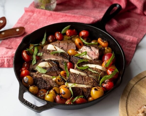 Lodge Cast Iron Skillet with Red Silicone Hot Handle Holder, 10.25-inch - Image 2
