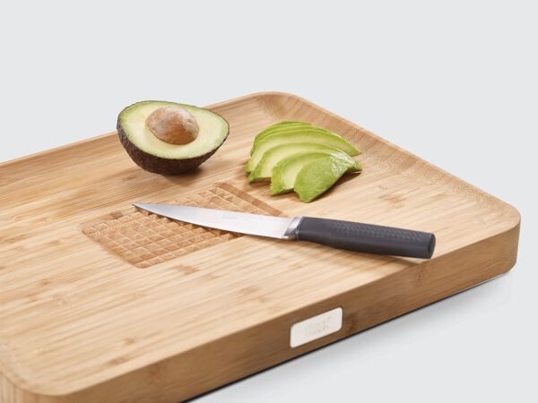 Joseph Joseph Cut & Carve Bamboo Cutting Board with Food Grip and Angled Surface Yellow Large - Image 4