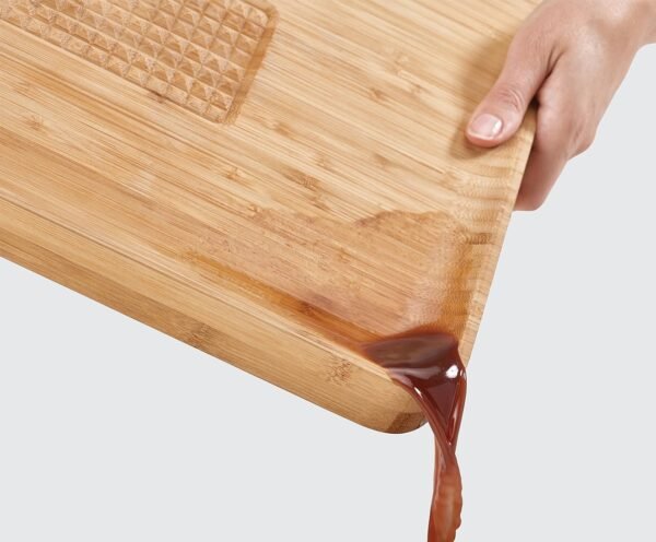 Joseph Joseph Cut & Carve Bamboo Cutting Board with Food Grip and Angled Surface Yellow Large - Image 6