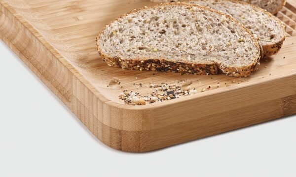 Joseph Joseph Cut & Carve Bamboo Cutting Board with Food Grip and Angled Surface Yellow Large - Image 3
